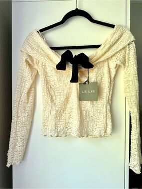 Le Lis Cream Textured Off-Shoulder Top with Black Bow Accent